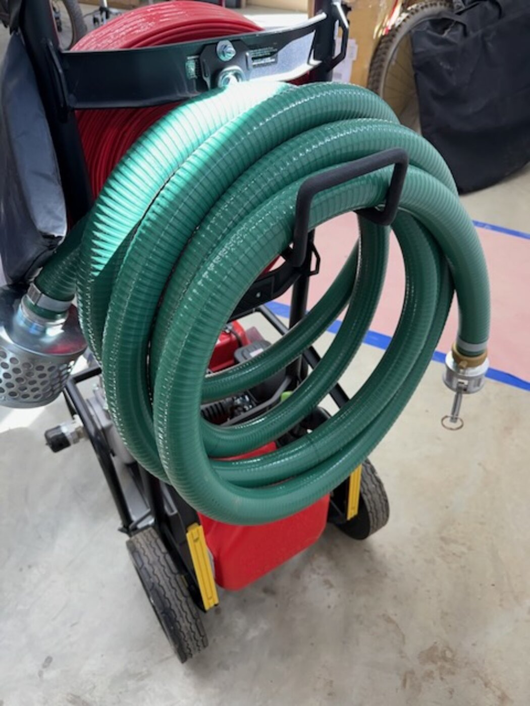 Coiled reinforced intake hose with a metal debris strainer on the FireReady HPS1